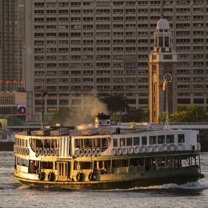 A Star Ferry sails across Victoria Harbour at sunset. Photo: Nora Tam