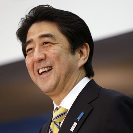 Japanese Prime Minister Shinzo Abe laughs while speaking at a press conference in Washington in February 2013. Japan’s ruling LDP planned to eugolise the slain former prime minister this week, but have instead postponed the plan until the fall Photo: AP/File
