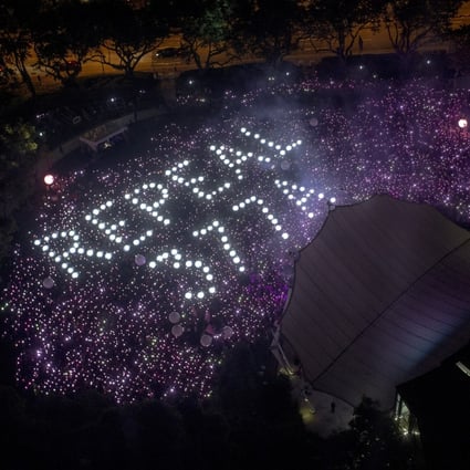 The words ‘Repeal 377A’ referencing a law that criminalises sexual acts between men in Singapore are formed by the crowd at 2019’s Pink Dot event. Photo: EPA-EFE