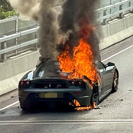 A Ferrari sports car is seen going up in flames at the Sha Tin-bound Shing Mun Tunnel Road near Mei Chung Court at about 2.30pm. Photo: Facebook