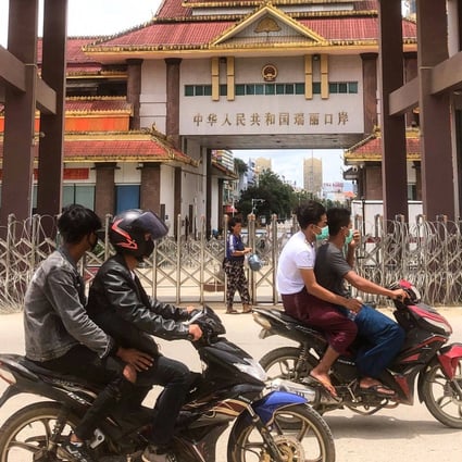 Motorists pass the China-Myanmar border gate in Muse last year. The town lies on the path of a proposed US$8.9 billion high-speed rail link that’s part of Beijing’s Belt and Road Initiative. Photo: AFP