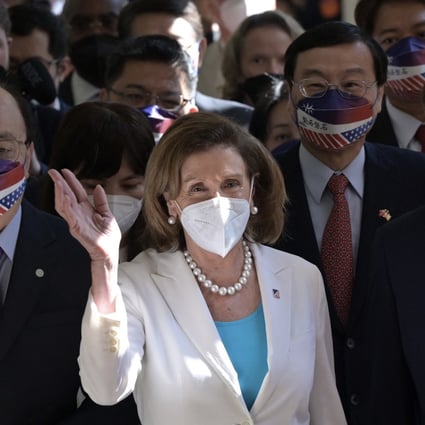 US House Speaker Nancy Pelosi waves to journalists during her arrival at the Parliament in Taipei on Wednesday. Photo: AFP