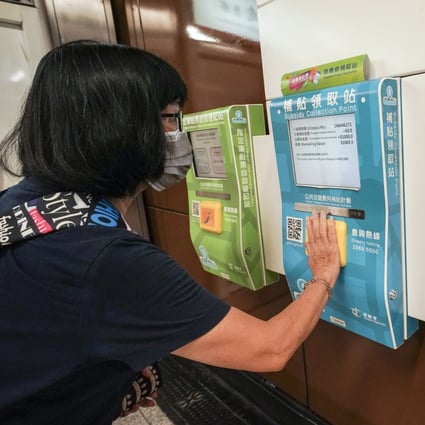 A Hong Kong resident adds consumption vouchers to her Octopus card in an earlier round of the economic stimulus scheme. Photo: Felix Wong.