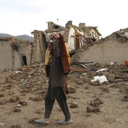 A man walks past houses damaged in an earthquake in Afghanistan’s Paktika province on June 23. Photo: Xinhua