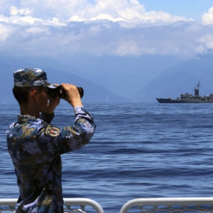 State news agency Xinhua published a photo of a Chinese serviceman looking at the Taiwan coast on board a warship. Photo: AP