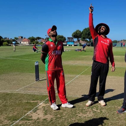 Kenya captain Rakep Patel (left) watches as his Hong Kong counterpart Nizakat Khan tosses the coin before the start of their Challenge League B game in Jersey. Photo: CHK