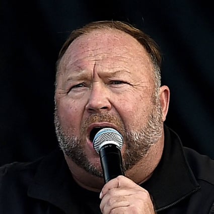 US far-right radio show Alex Jones speaks to Trump supporters as they demonstrate in Washington in December 2020. Photo: AFP