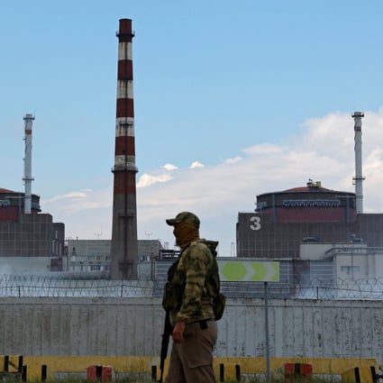 A serviceman with a Russian flag on his uniform stands guard near the Zaporizhzhia nuclear power plant outside the Russian-controlled city of Enerhodar in the Zaporizhzhia region, Ukraine. Photo: Reuters