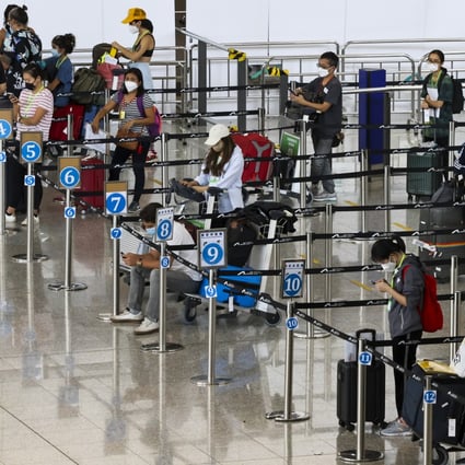 Arrivals at Hong Kong’s airport wait to be taken to their quarantine hotels. Photo: K. Y. Cheng