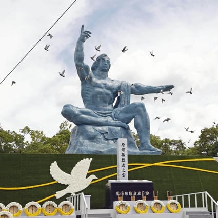 Doves are released at the Peace Park in Nagasaki on Tuesday during a ceremony marking the 77th anniversary of the atomic bombing of the city. Photo: Kyodo