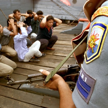 The Indonesian Navy conducts a drill with sailors role-paying as ship hijackers at the Singapore Strait near Batam in 2000. File photo: AP
