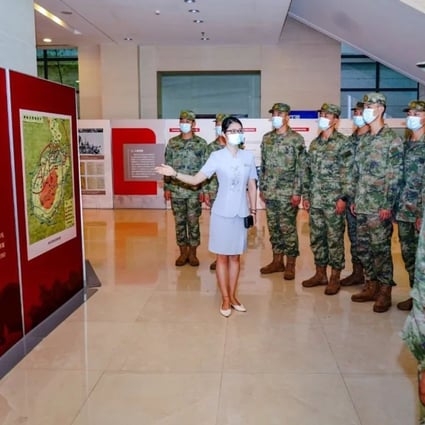 PLA troops visit the exhibition about the battle for Hainan. Photo: QQ.com