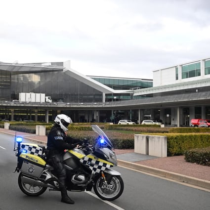 Australian Federal Police gather at Canberra Airport after a man fired at least three gunshots on August 14. The airport was evacuated and a man was arrested in relation to the event, with police confirming there have been no reported injuries.  Photo: EPA-EFE