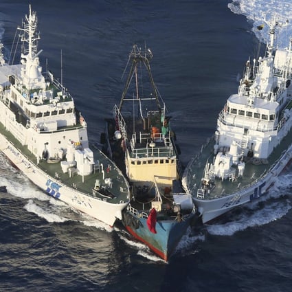Japanese coastguard ships intercept the Kai Fung No 2 at the Diaoyu Islands in 2012 . Photo: AFP
