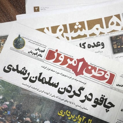 Front pages of the August 13 editions of Iranian newspapers Vatan-e Emrooz, front, with the headline in Farsi: ‘Knife in the neck of Salman Rushdie,’ and Hamshahri, rear, with the title: ‘Attack on writer of Satanic Verses’ in Tehran, Iran on Saturday. Photo: AP 