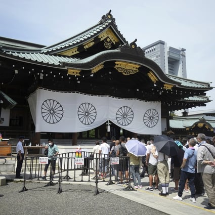 People pay respects to Japan’s war dead at the Yasukuni Shrine in Tokyo on Monday. Photo: AP