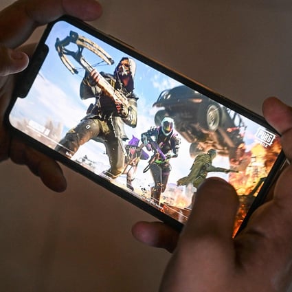 A gamer plays the PUBG Mobile game on a smartphone. Photo: AFP