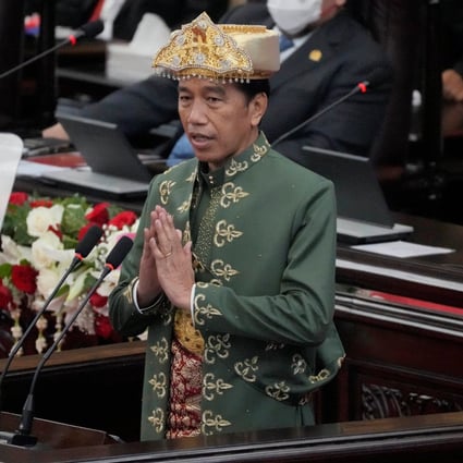 Indonesian President Joko Widodo, wearing traditional attire from the Bangka Belitung islands, gestures as he delivers a state of the nation address in Jakarta on Tuesday ahead of the country’s independence day. Photo: Reuters