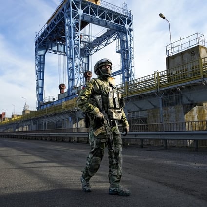 A Russian soldier patrols an area at the Kakhovka Hydroelectric Station in the Kherson region, southern Ukraine. File photo: AP