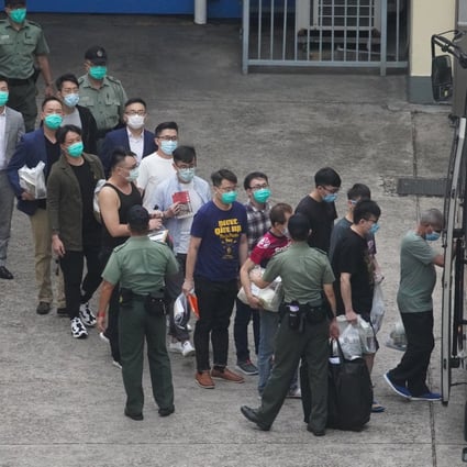Some of the 47 suspects leave Lai Chi Kok Reception Centre last year. Photo: Winson Wong