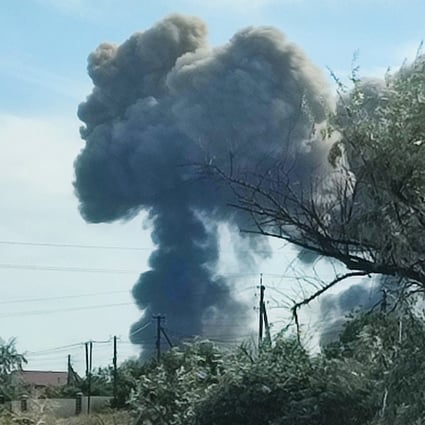 Smoke rises after explosions were heard from the direction of a Russian military airbase in Crimea. Photo: Reuters