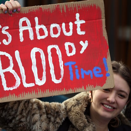 A supporter of the Period Products bill at a rally outside parliament in Edinburgh in November 2020. Photo: DPA