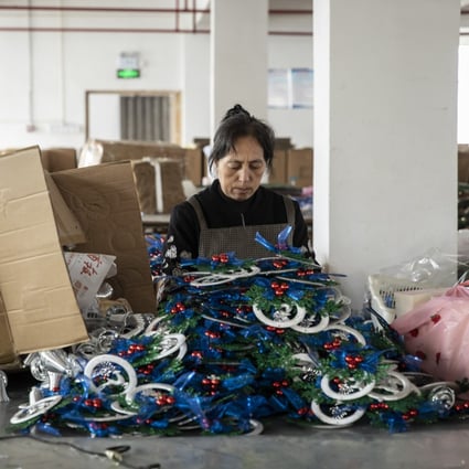 A worker packs Christmas ornaments on the production floor of a factory in Yiwu, China, Oct. 19, 2021. Photo: Bloomberg