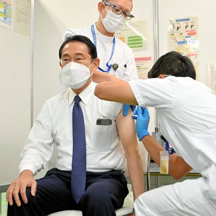 Japan’s Prime Minister Fumio Kishida (left) receiving a fourth dose of Covid-19 vaccine in Tokyo earlier this month. Photo: AFP