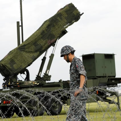 Japan is considering amassing an arsenal of more than 1,000 of its planned long-range missiles, the Yomiuri newspaper reported, citing unidentified people with knowledge of the plans. Photo: AP/File