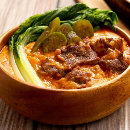 The classic umami Filipino dish kare-kare is a thick, peanutty stew flavoured with bagoong - fermented fish sauce. Chefs around the world use similar sauces to deliver a flavour kick. Photo: Shutterstock