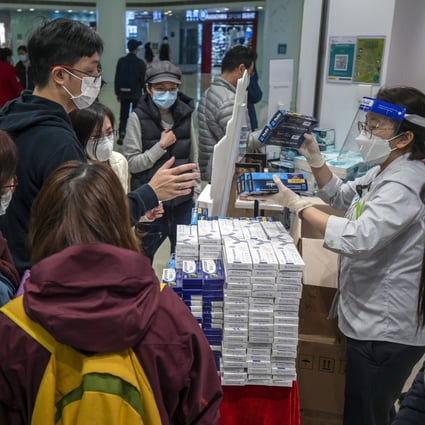 Customers purchase Covid-19 rapid antigen test kits at a store in Hong Kong on February 18. More than half a million RATs are taken every day in Hong Kong, generating more than 3.5 million pieces of plastic from the test kits. Photo: Bloomberg