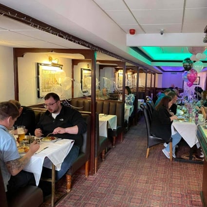 Customers dine at the Light of India restaurant in Britain. Photo: Facebook