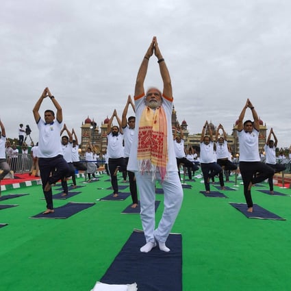 India’s Prime Minister Narendra Modi at the International Day of Yoga in front of Mysore Palace on June 21. Observers are questioning his balancing act. Photo: AFP