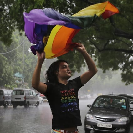 A gay rights activist celebrates after the country’s top court struck down a colonial-era law that made homosexual acts punishable by up to 10 years in prison, in New Delhi, India Sept. 6, 2018, a landmark victory for gay rights that one judge said would “pave the way for a better future.” Photo: AP/File