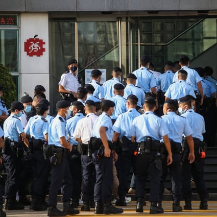 Police officers gather at the Next Digital building in Tseung Kwan O last year. Photo: Winson Wong