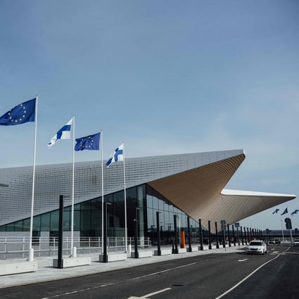 Finnish and EU flags wave outside Helsinki airport in Vantaa, Finland. More than 1 million Russian citizens have entered the bloc through land border crossing points since the beginning of the Ukraine invasion, most of them via Finland and Estonia. Photo: AFP