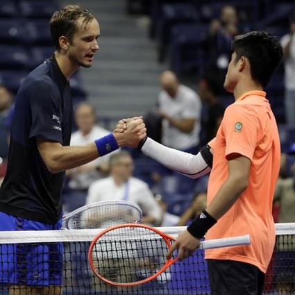 Daniil Medvedev shakes hands with Wu Yibing after their third round clash. Photo: EPA-EFE