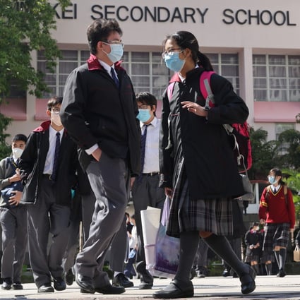 Students leave Christian and Missionary Alliance Sun Kei Secondary School in Tseung Kwan O on January 20. Secondary schools that want to hold full-day, in-person classes must ensure 90 per cent of students have three Covid-19 vaccinations by November 1. Photo: May Tse