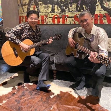 Lawrence Wong and Malaysian finance minister Tengku Zafrul Abdul Aziz strum guitars after a private dinner on September 4, 2022. Photo: Handout