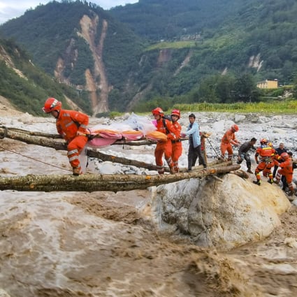 Survivors are taken to safety through treacherous terrain in Moxi town of Luding county, in the Chinese province of Sichuan. Photo: Xinhua