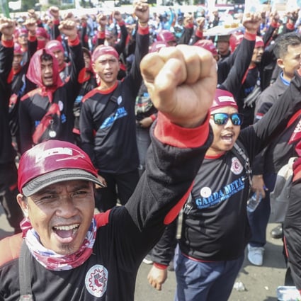 Labourers shout slogans during a protest in Jakarta on Tuesday against Indonesia’s recent fuel price increase. Photo: EPA-EFE