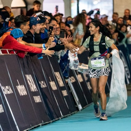Fans celebrate with Sunmaya Budha as she crosses the finish line in second at the UTMB CCC. Photos: Olly Bowman/Asia Pacific Adventure