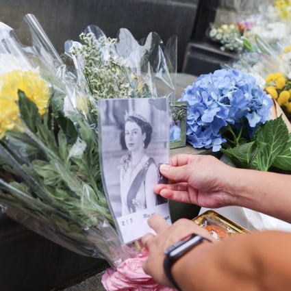 People leave floral tributes outside the British Consulate-General in Hong Kong after hearing the news of Queen Elizabeth’s death. Photo: Dickson Lee