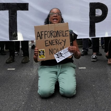 Demonstrators block a street in Canary Wharf during a protest outside the Ofgem headquarters in London on August 26. Britain’s struggles look set to continue as an inexperienced government faces multiple crises. Photo: Reuters