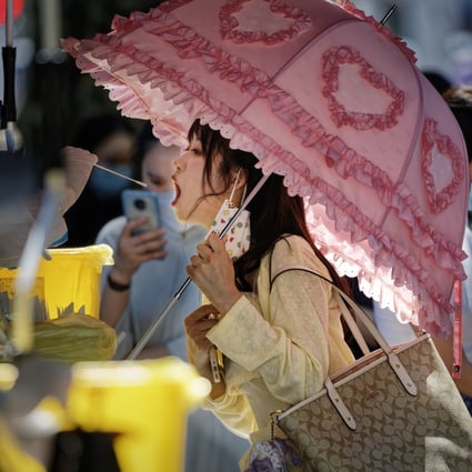 A woman takes a coronavirus test in Shanghai in this file photo from August. China has adopted stricter Covid-19 policies since an outbreak in Shanghai earlier this year. Photo: EPA-EFE