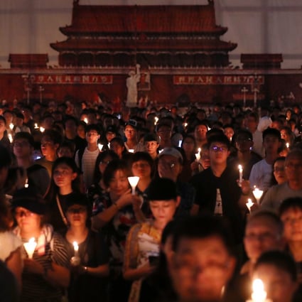 Crowds hold up their candles at the June 4 vigil in 2019 in Victoria Park, Causeway Bay. The event has since been banned on public health grounds. Photo: Sam Tsang