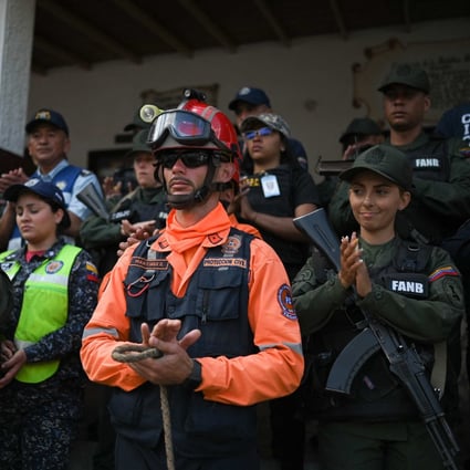 Civilian and military authorities celebrate on Friday the location of 16 people who went missing in La Grita, Venezuela. Photo: AFP