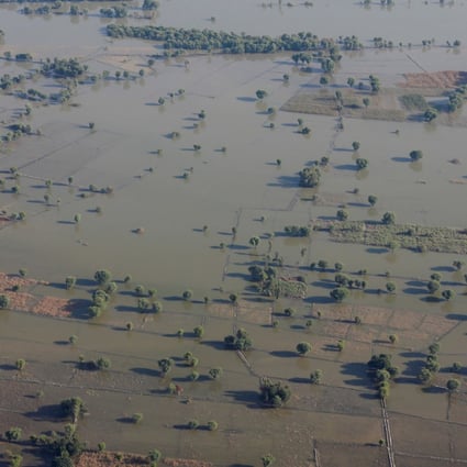 A submerged field and a village following rains and floods during the monsoon season in Sukkur, Pakistan, on Saturday. Photo: Reuters
