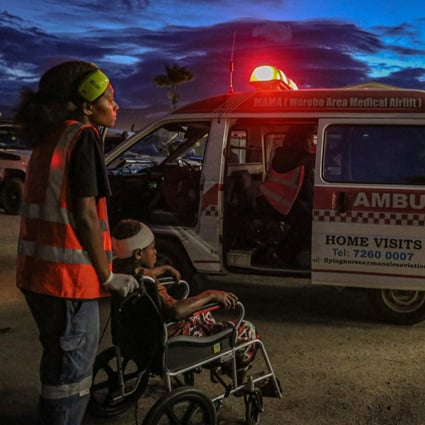 Injured villagers arrive at a hospital after being evacuated via helicopter in Papua New Guinea  on Sunday. Photo: AFP