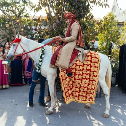 The groom on a horse during an Indian wedding ceremony in Bangkok, Thailand. Photo: Shutterstock